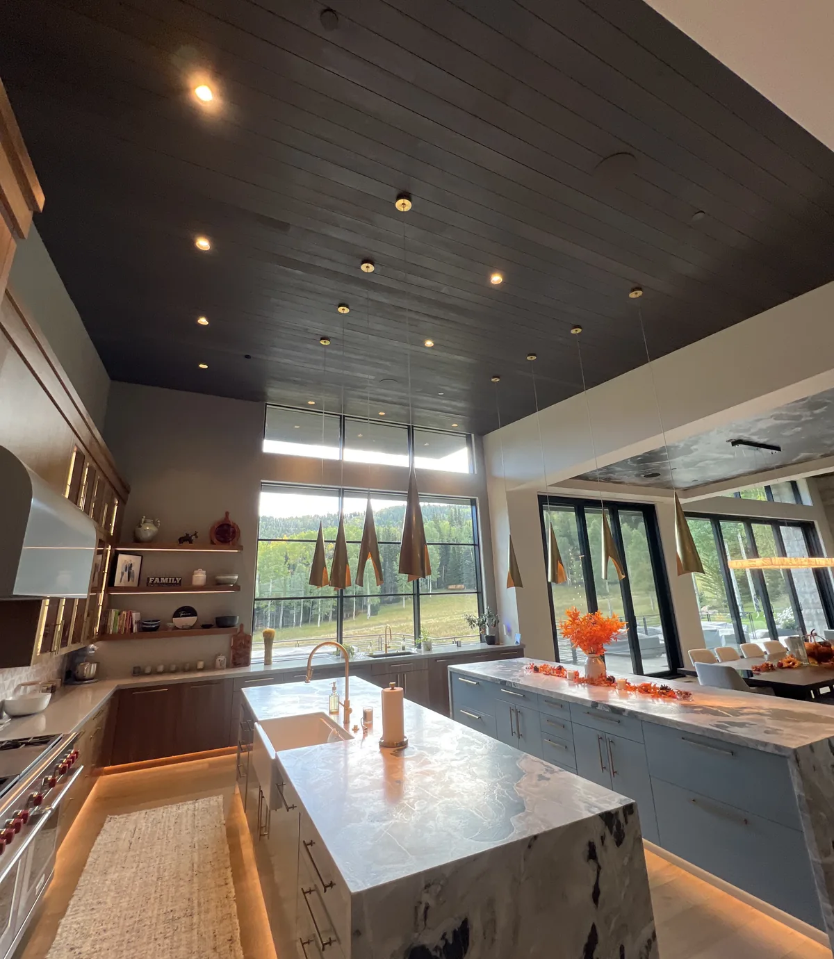 Chef's kitchen with marble island and mountain views